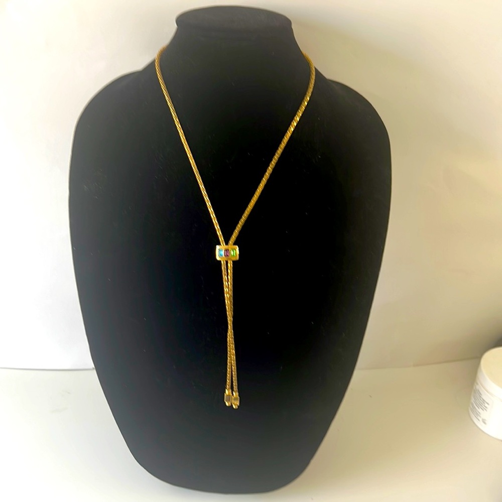 Gold chain with moveable link, 30” long. Blue,green & pink crystals on chain